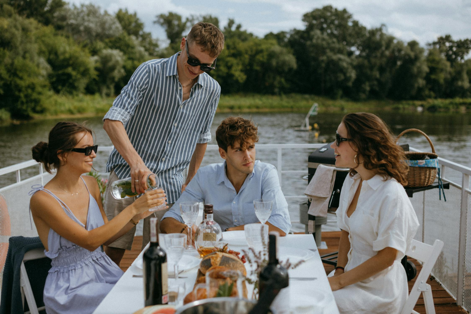 Friends sharing a meal on a boat